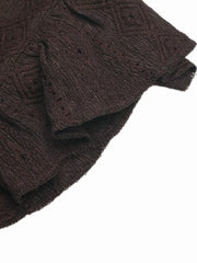 Brown lace-trimmed ruffled V-neck maternity shirt with textured fabric and diamond pattern detail.