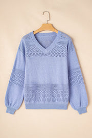 Light blue perforated knit V-neck pullover sweater with balloon sleeves and textured detail.