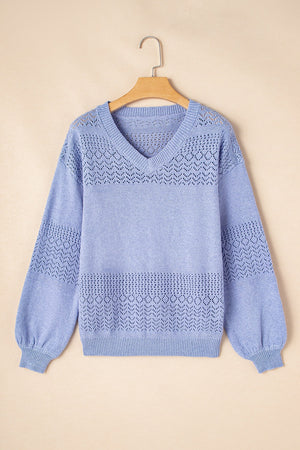 Light blue perforated knit V-neck pullover sweater with balloon sleeves and textured detail.
