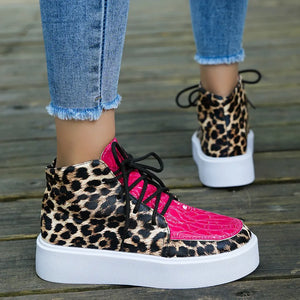 Patent leopard platform high-tops with hot pink accents and white soles.
