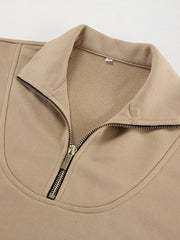 Camel quarter zip top with a gold zipper detail and collared neckline.