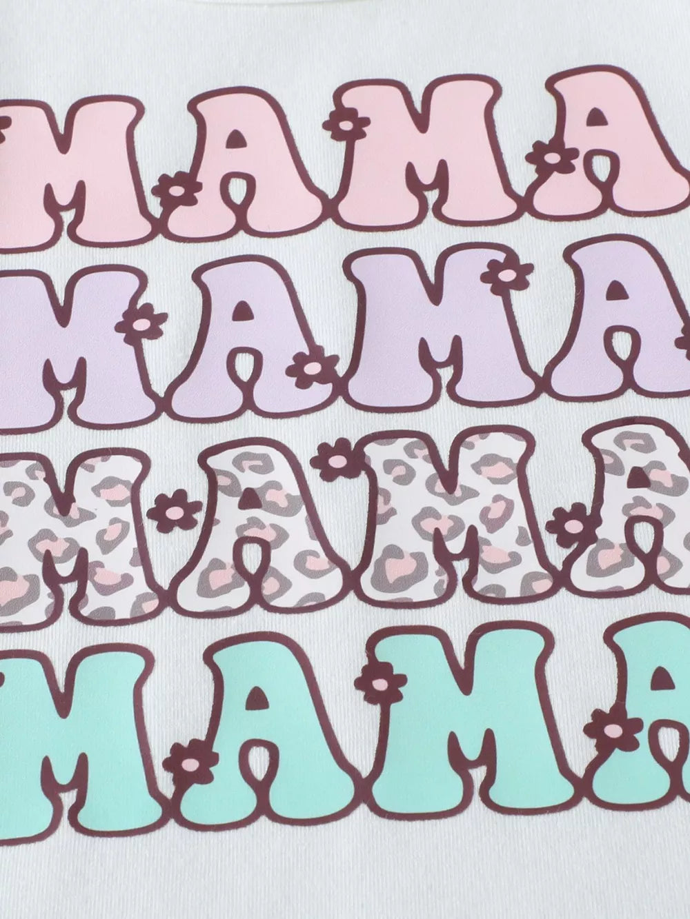 White cotton baby tee with stacked "Mama" graphic in pink, purple, leopard print, and mint blue.