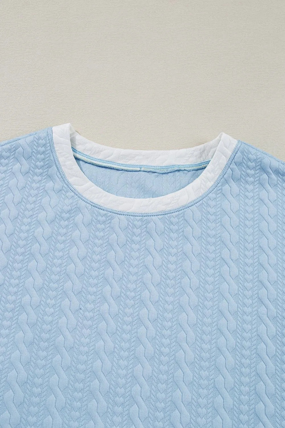 Light blue cable knit loungewear top with contrast white trim neckline