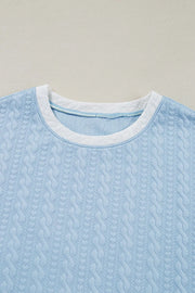 Light blue cable knit loungewear top with contrast white trim neckline