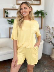 Yellow bamboo loungewear set with relaxed fit tee and shorts, featuring a chest pocket.