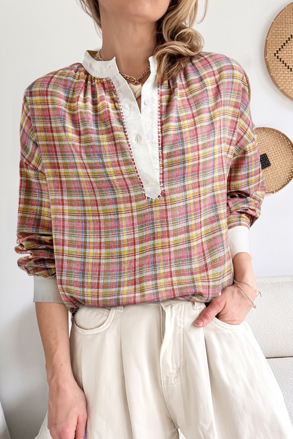 Bohemian plaid blouse with mandarin collar and buttoned placket in dusty pink hues.