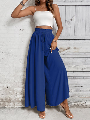 Royal blue palazzo trousers with ruffled waistline and drawstring detail.