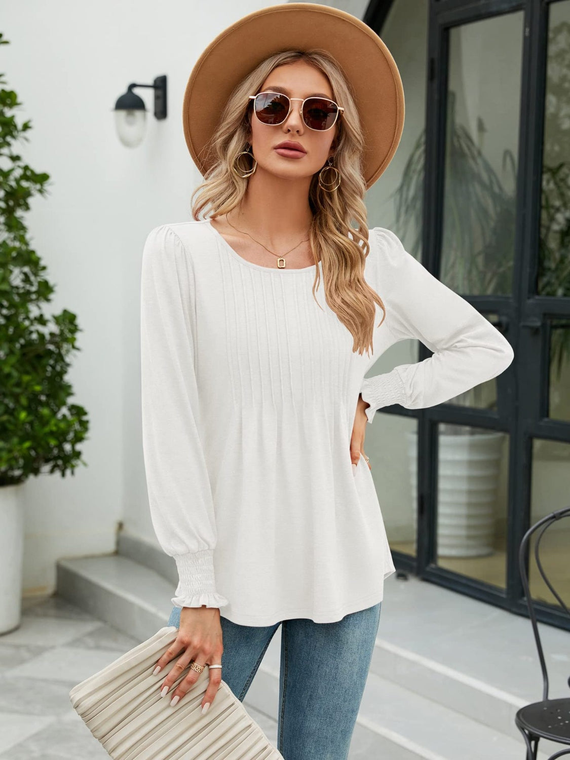 White long sleeve blouse with pleated bodice and gathered sleeves