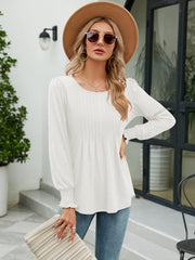 White long sleeve blouse with pleated bodice and gathered sleeves