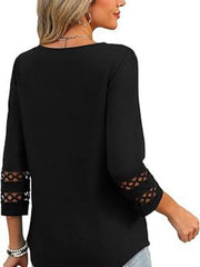Black 3/4 sleeve t-shirt with cutout detail on sleeves.