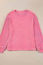 Textured stripe balloon sleeve top in pink and white with a crew neck.