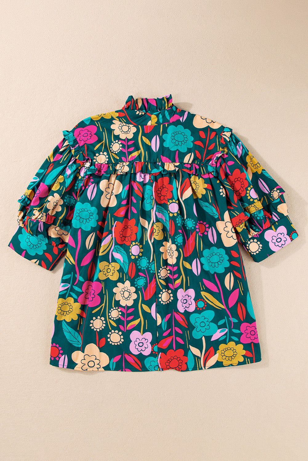 Botanical ruffle-sleeve tie-neck blouse in floral print with ruffled neckline and sleeves.