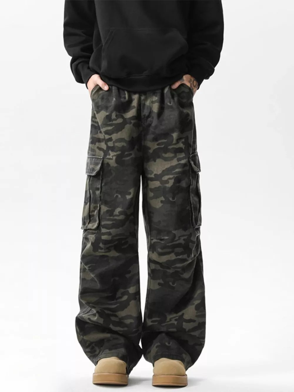 Relaxed fit dark camo cargo pants with multiple pockets and adjustable waist.