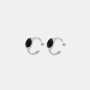 Silver hoop earrings with oval tiger's eye stones