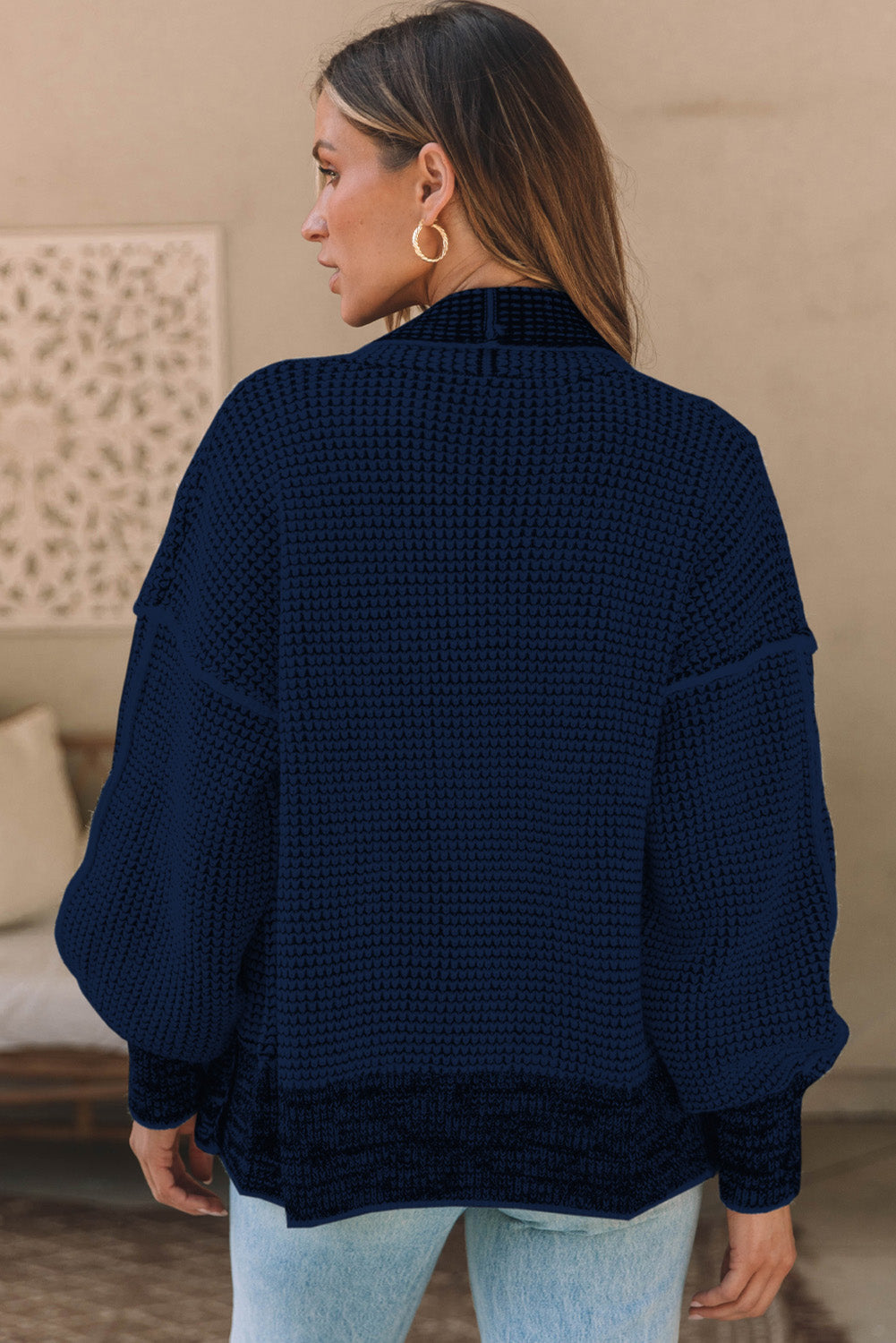 Navy textured open-front knit cardigan with waffle weave and relaxed fit.