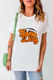 White t-shirt with retro orange Game Day football graphic and rolled sleeves.