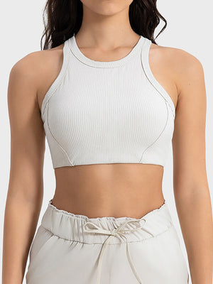 White ribbed racerback crop top with contour stitching and a high neckline.