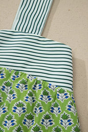 Floral tie-strap tank top with square neckline, green and white stripes and blue floral print.