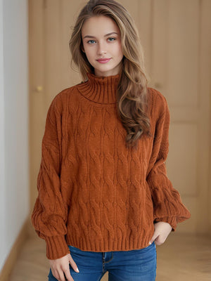 Caramel oversized cable knit turtleneck sweater with ribbed cuffs and hem.