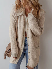 Beige textured button-up cardigan with collar, pockets, and ribbed cuffs.