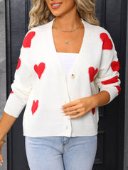 White acrylic knit cardigan with red heart pattern, button front, V-neck.