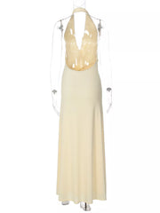 Yellow halter neck ruched maxi dress with plunging neckline and open back.