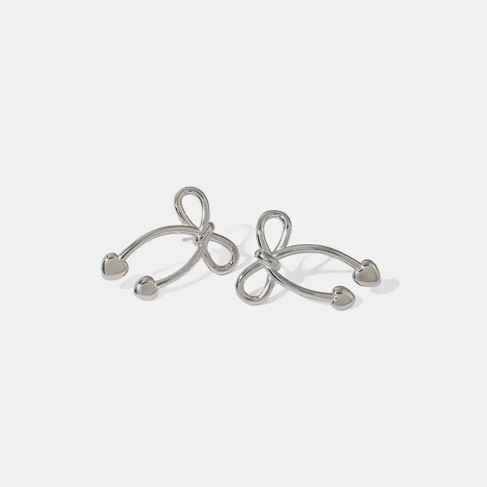 Silver bow drop earrings with heart tips