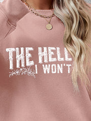 Blush pink crewneck sweatshirt with white graphic text and floral detail