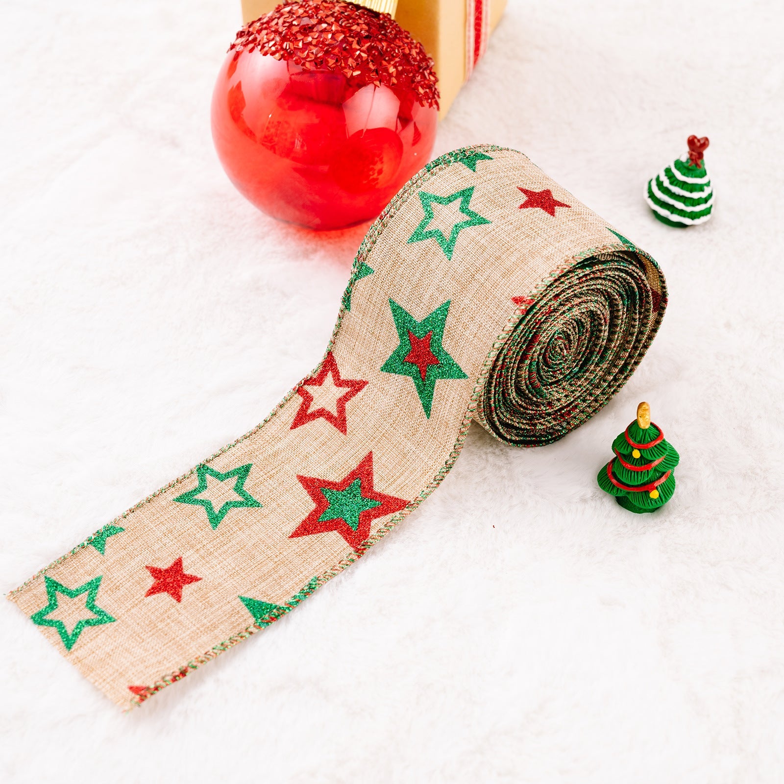 Burlap ribbon with red and green stars, perfect for festive holiday crafts.