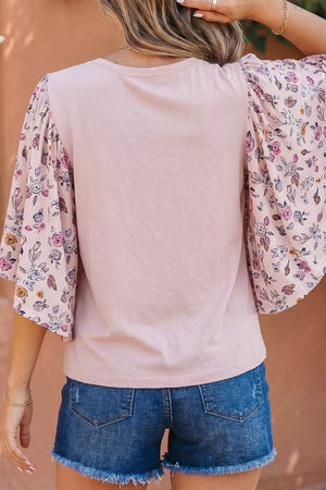 Maternity crew neck shirt in pink with floral patchwork sleeves.