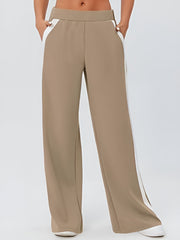 Camel palazzo trousers with white contrast side panels and pockets.