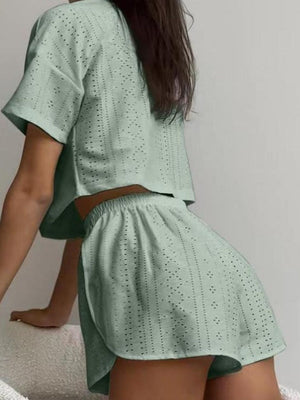 Sage green perforated crop top and shorts set with short sleeves and elastic waist.