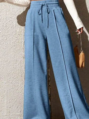 Sky blue wide-leg sweatpants with drawstring waist and front seam detail