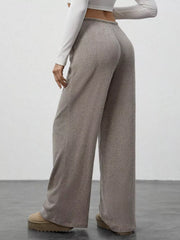 Mocha ribbed wide-leg pants with drawstring waist, shown from the back.