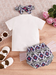 Baby girls' cotton set with white tee and tribal print shorts and headband.