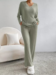 Green ribbed knit V-neck loungewear set with long sleeves and wide-leg pants.