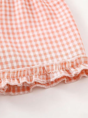 Children's cotton gingham ruffle set in blush pink.
