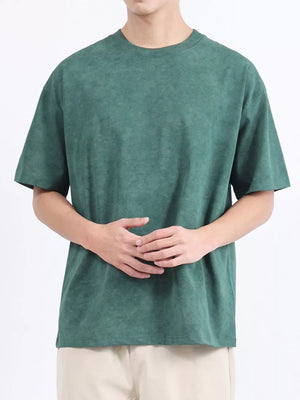 Men's dark green relaxed fit t-shirt with a subtle washed effect, crew neck, and short sleeves.