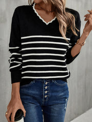 Black and white striped knit sweater with scalloped trim V-neck and long sleeves.