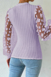 Lavender knit blouse with sheer floral appliqué sleeves