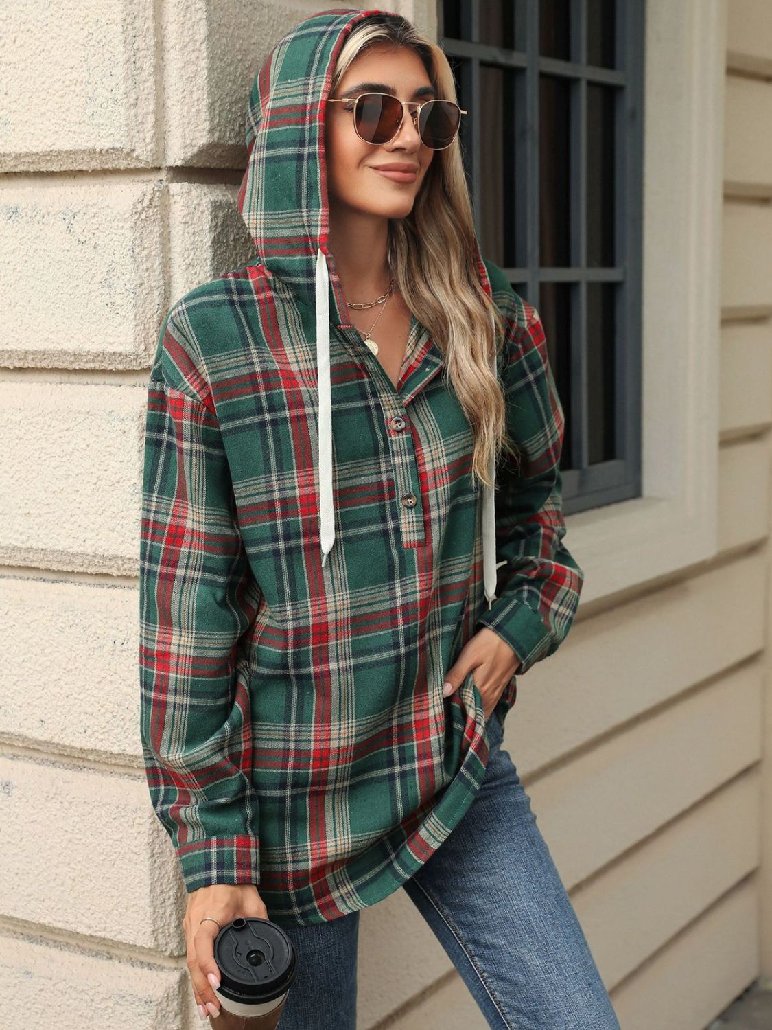 Green plaid hooded henley shirt with button detail and white drawstrings.