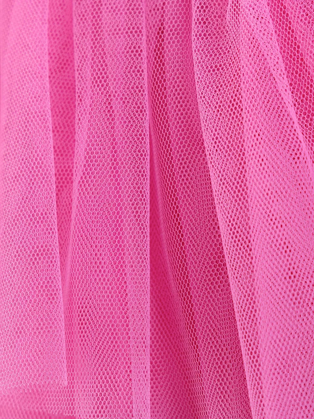 Pink tulle layered baby dress with a close-up view of the fabric texture.