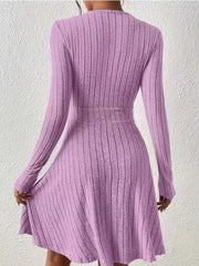 Lavender ribbed wrap mini dress with long sleeves and A-line skirt.