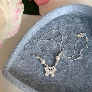 Charming butterfly and pearl necklace with silver beads and chain.