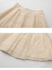 Apricot lace two-piece set ensemble skirt detail with embroidered pattern.
