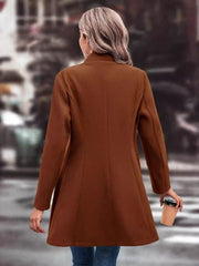 Brown wool blend overcoat with a sculpted flare hem and buttoned front, shown from the back.