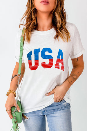 White t-shirt with USA appliqué and rolled cuffs.