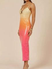 Sequined cami dress with yellow to orange to pink gradient and starfish detail.