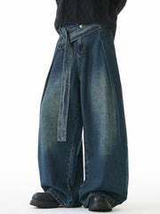 Belted relaxed fit men's jeans in vintage blue denim with a tie waist.