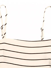 Patterned cutout maxi dress with smocked detail in apricot with brown stripes.